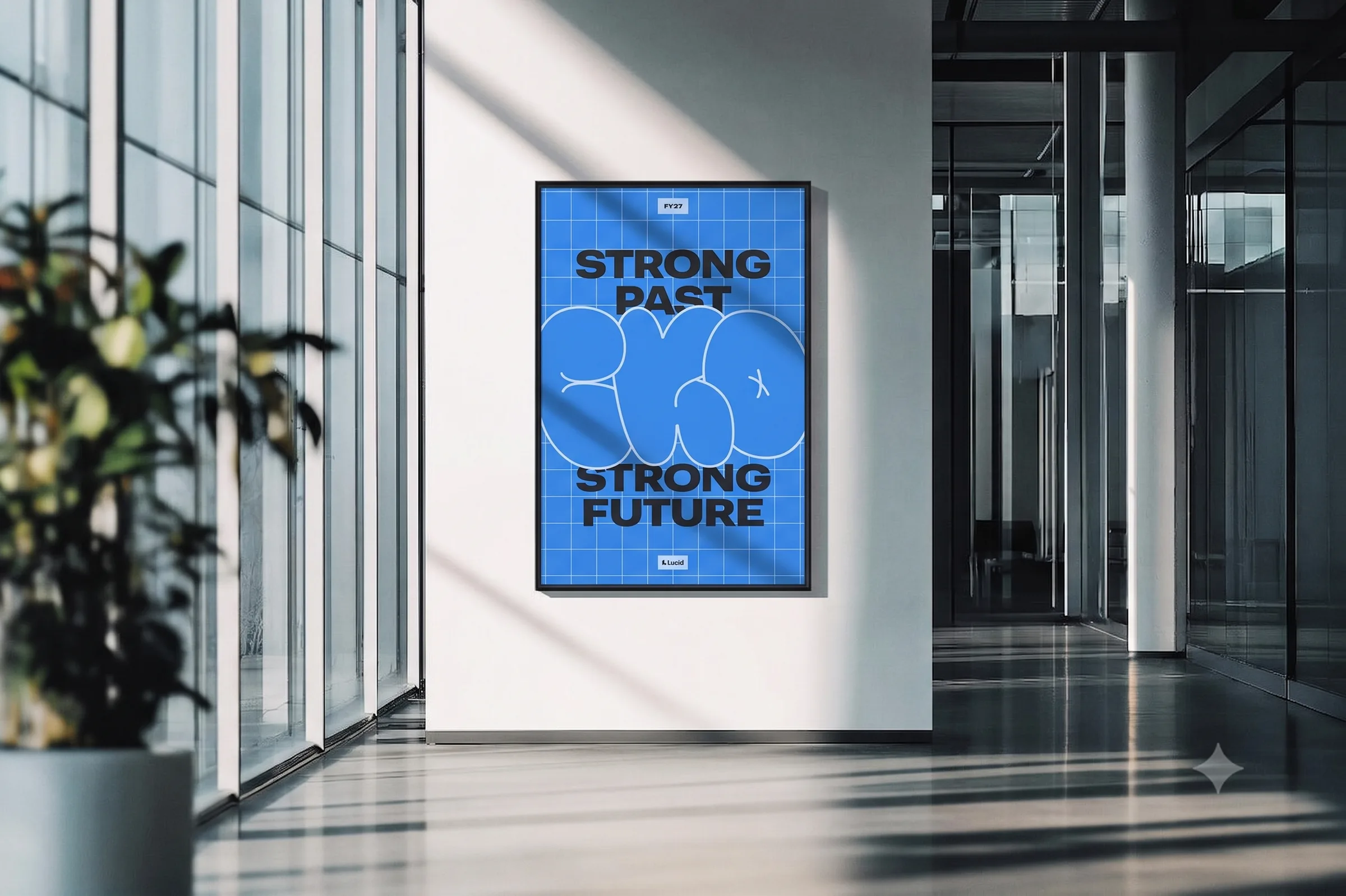 A blue grid poster reading “Strong Past, Strong Future” with the CKO logo, framed on a wall in a sunny office hallway.