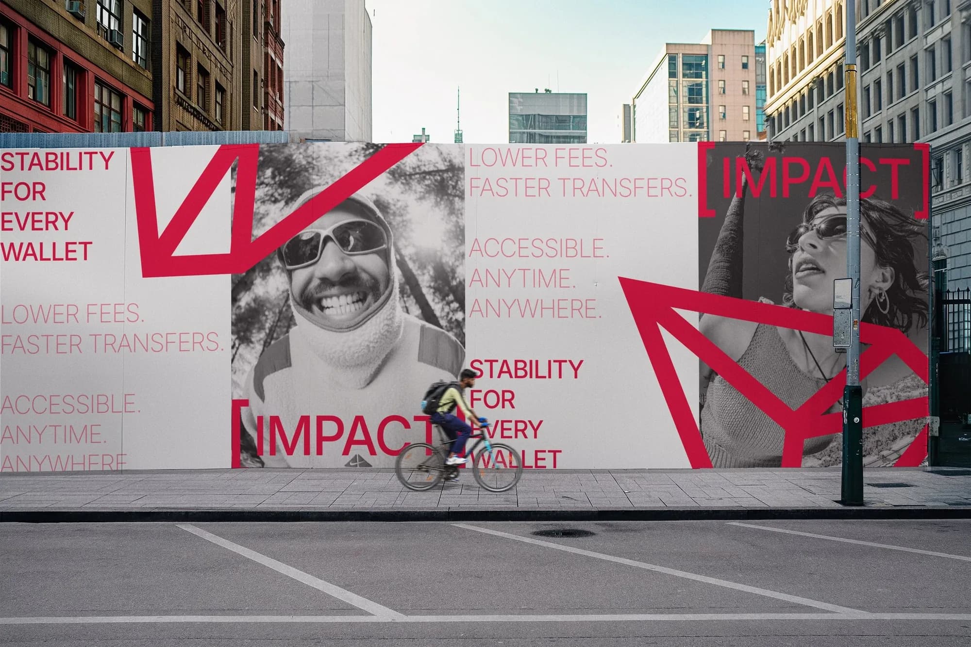 A long street banner mixing desaturated portraits, red TRON shapes and the campaign lines, with a cyclist passing.